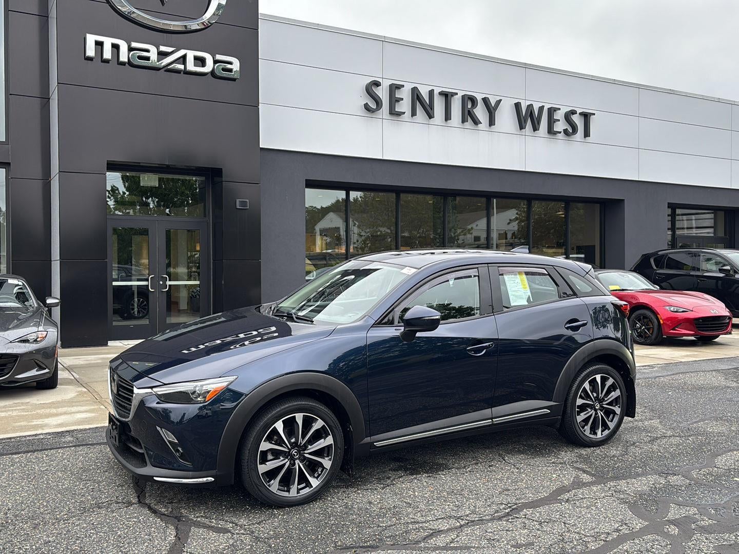 2019 Mazda Mazda CX-3 Grand Touring in Deep Crystal Blue Mica — front three-quarter view